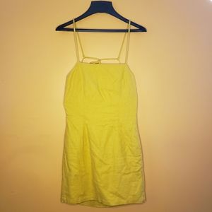 Yellow mini, open back dress.